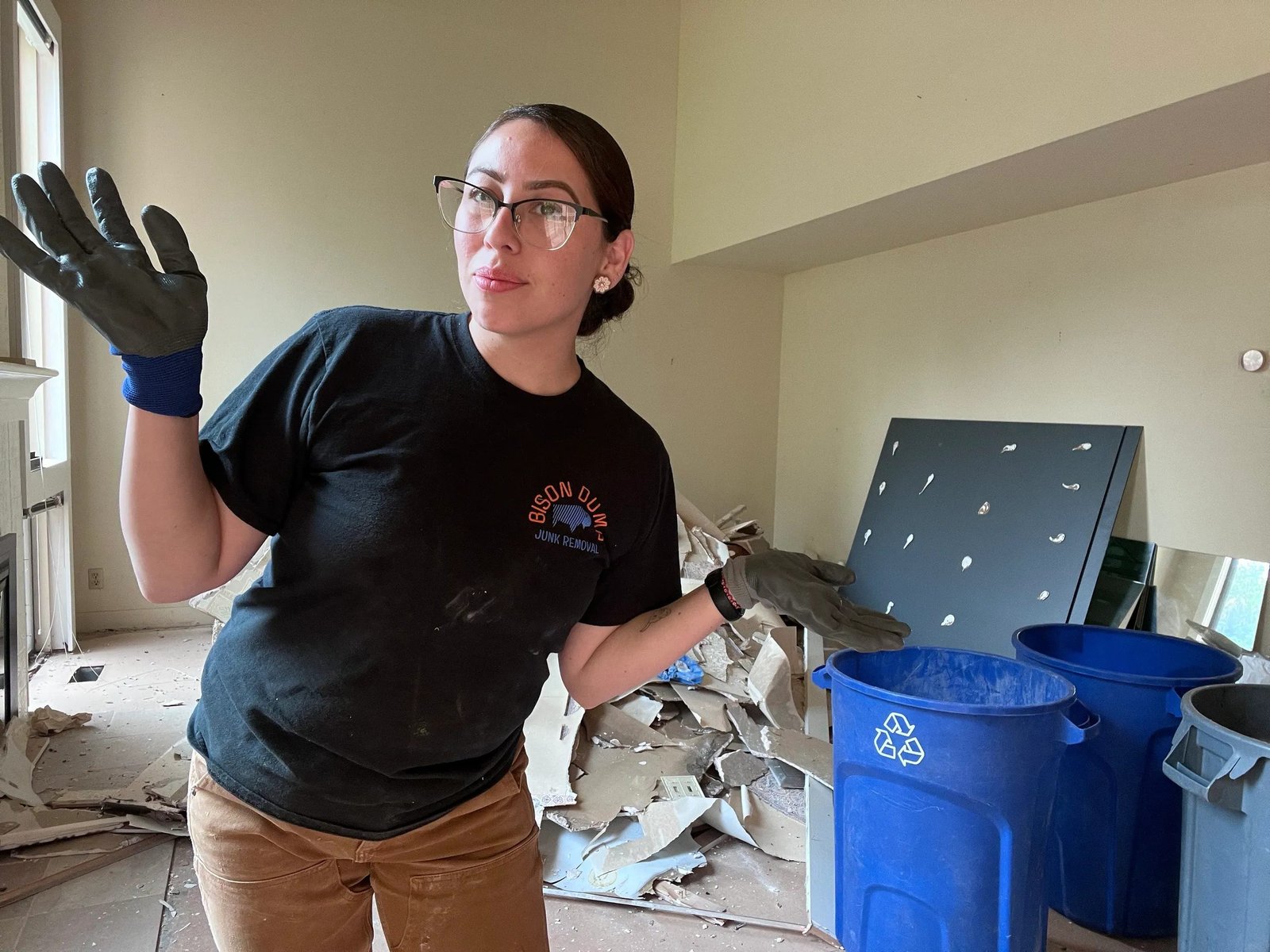 Smiling Bison Dump crew member during a household cleanout in Salem, Oregon