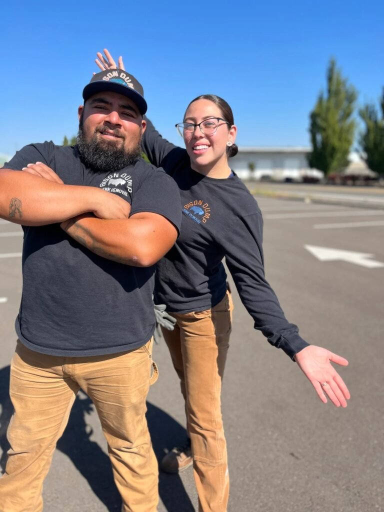 Bison Dump's family-owned Salem junk removal crew standing together on the job