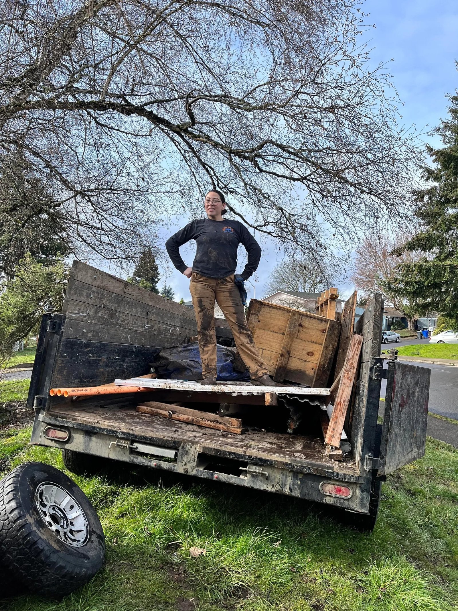 Bison Dump truck loaded with scrap metal and debris from a Salem-area cleanout