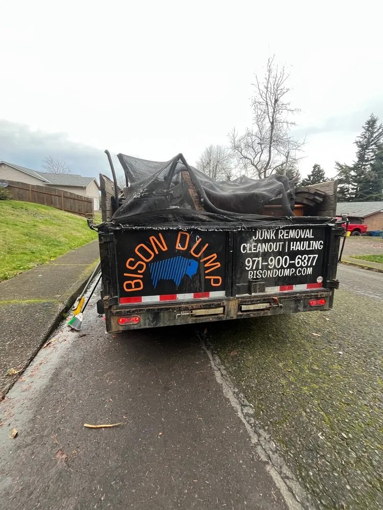 Bison Dump truck loaded with debris for hauling and disposal in Salem, Oregon
