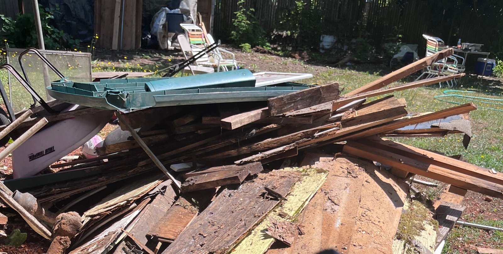 Pile of construction debris and scrap wood cleared by Bison Dump on a Salem jobsite cleanup
