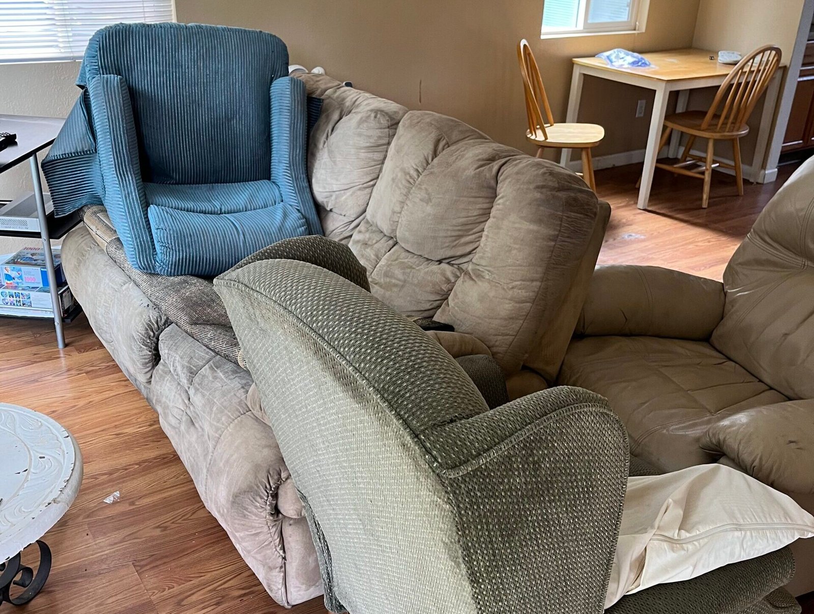 Gray sectional sofa removed and hauled away during a Bison Dump Salem furniture removal job