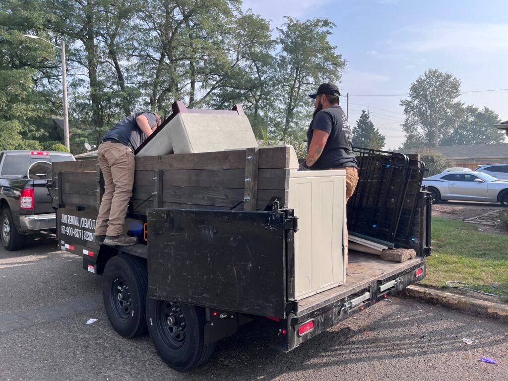 Bison Dump truck filled with household junk during a full-load cleanout in Salem, Oregon