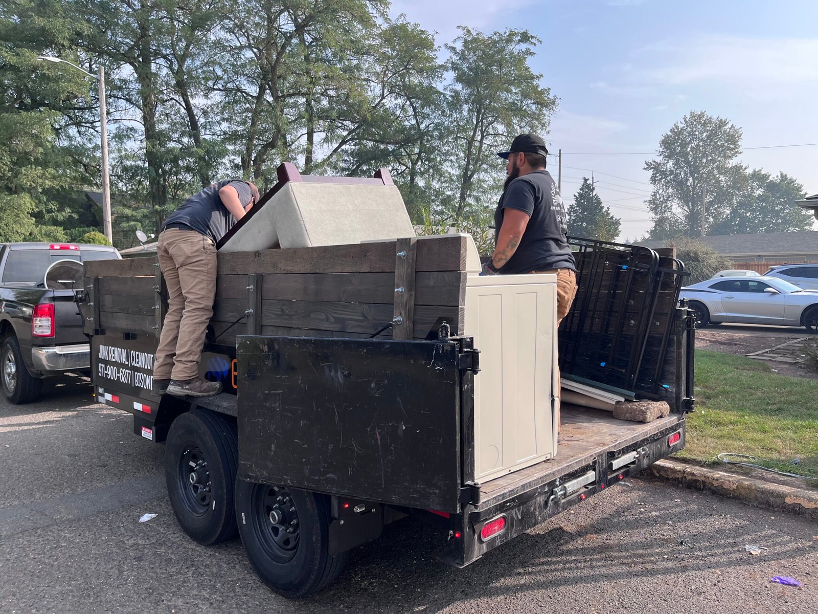 Bison Dump truck filled with household junk during a full-load cleanout in Salem, Oregon