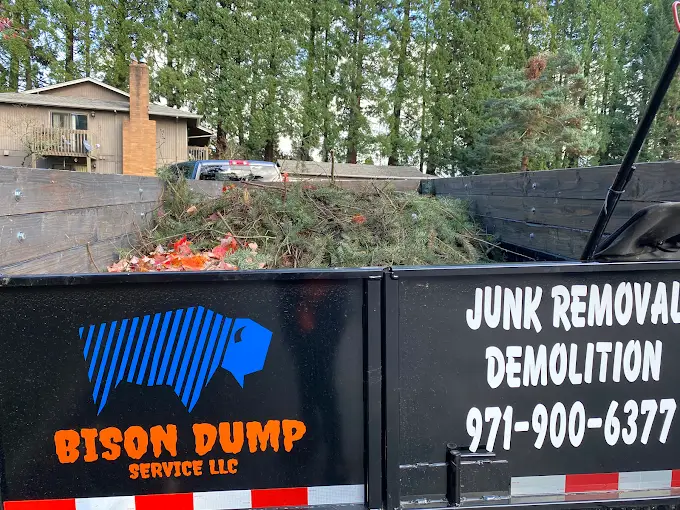 Trailer filled with branches and yard debris during a cleanup job